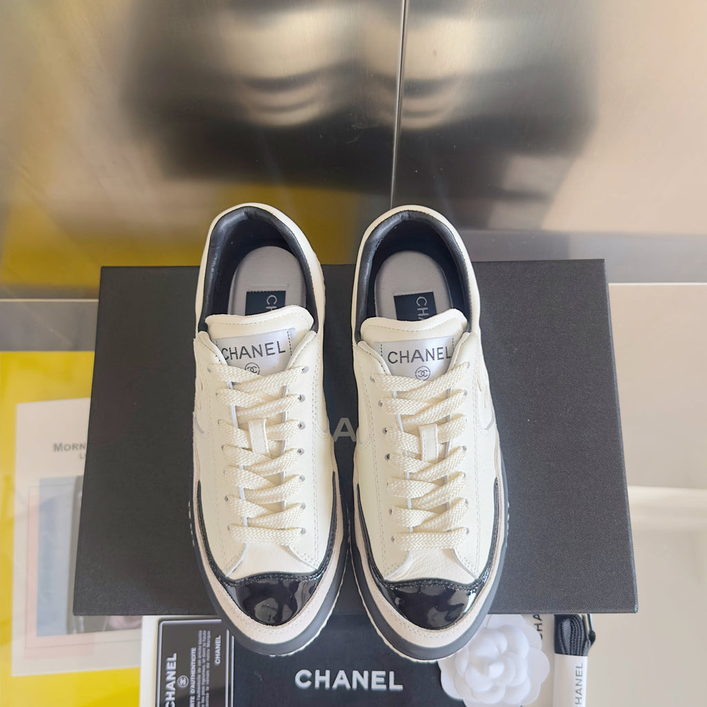 CHANEL 25S SNEAKERS WITH PATENT TOE 20MM IN WHITE CALFSKIN