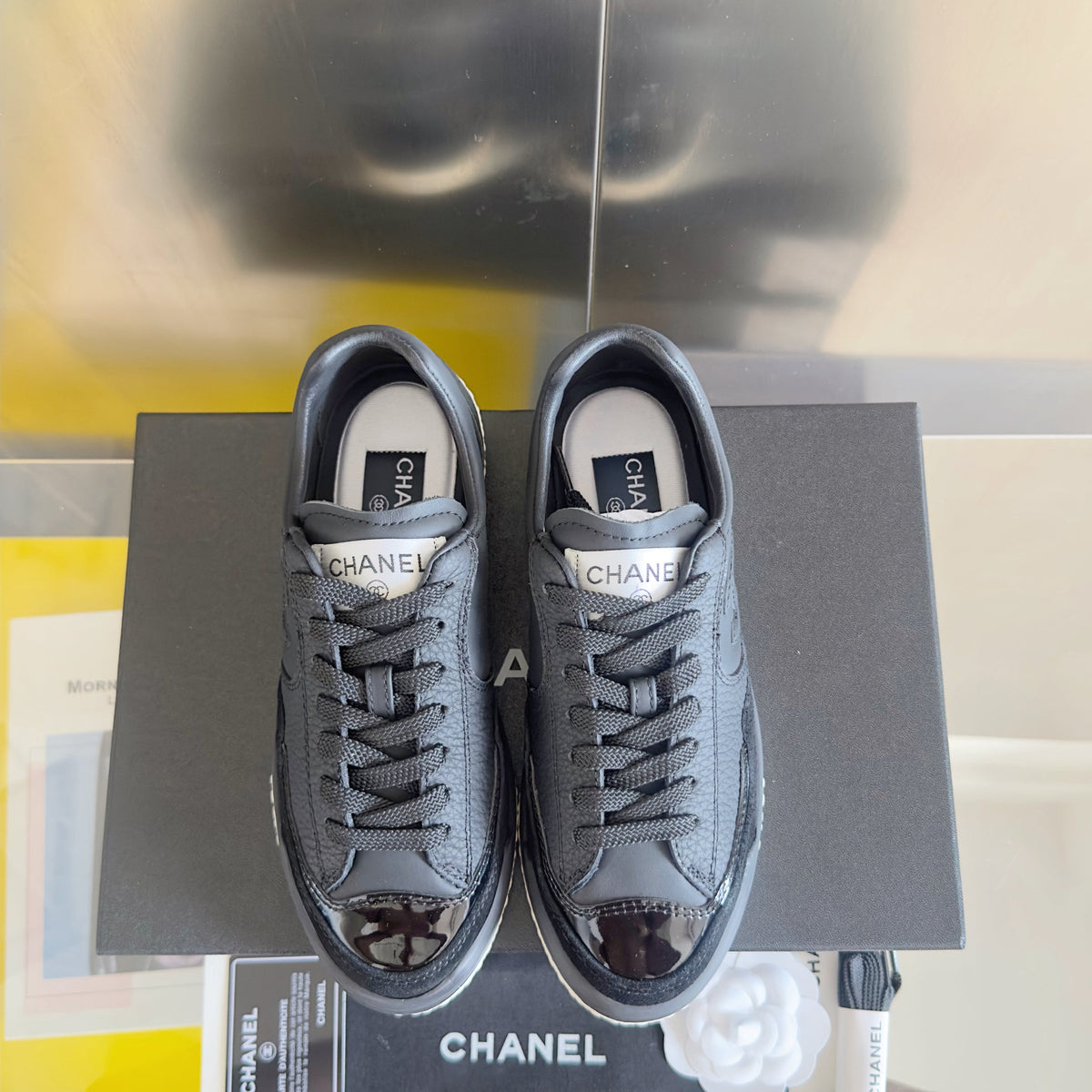 CHANEL 25S SNEAKERS WITH PATENT TOE 20MM IN BLACK CALFSKIN
