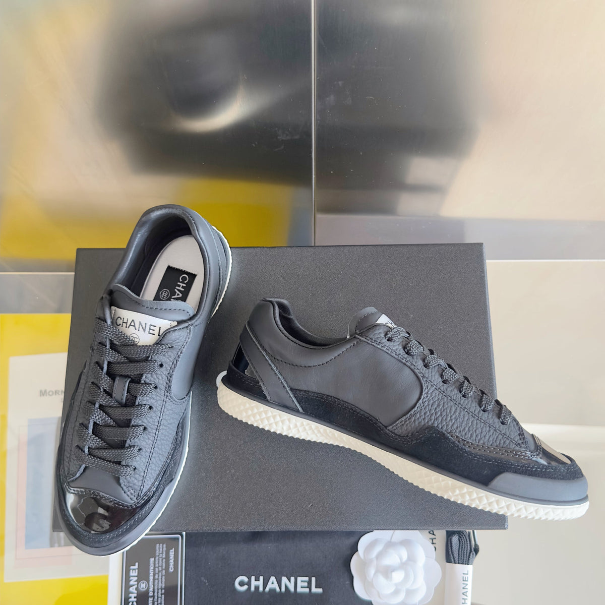 CHANEL 25S SNEAKERS WITH PATENT TOE 20MM IN BLACK CALFSKIN