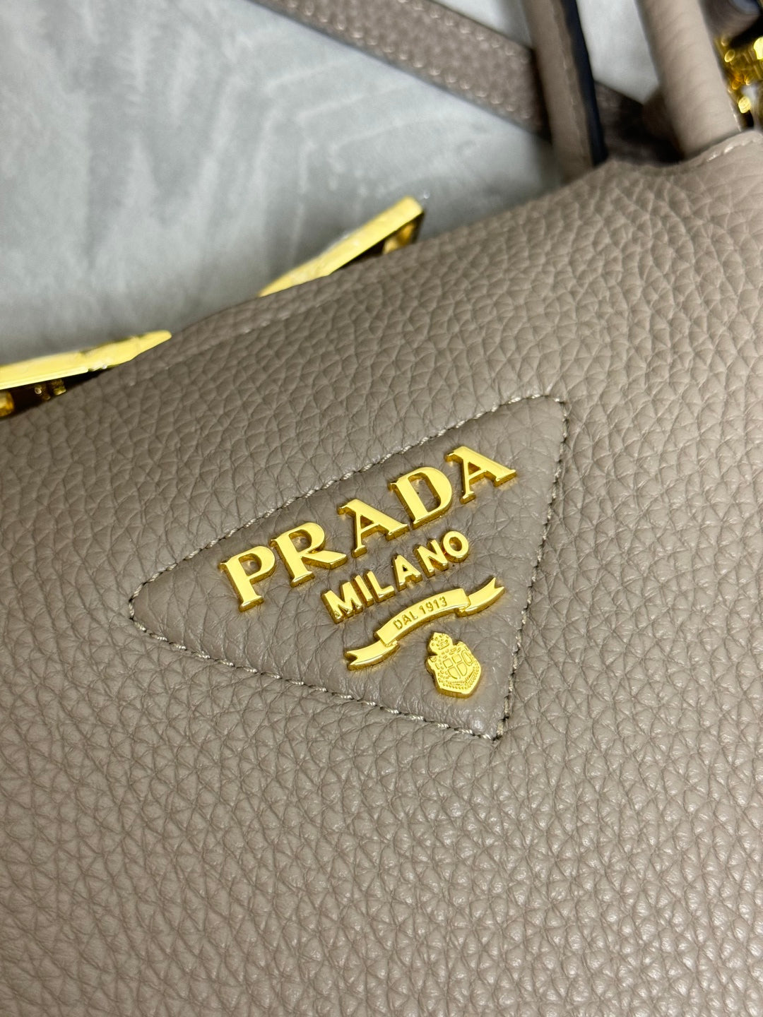 PRADA 25S SMALL BAG 23 IN TAUPE CALFSKIN GOLD HARDWARE