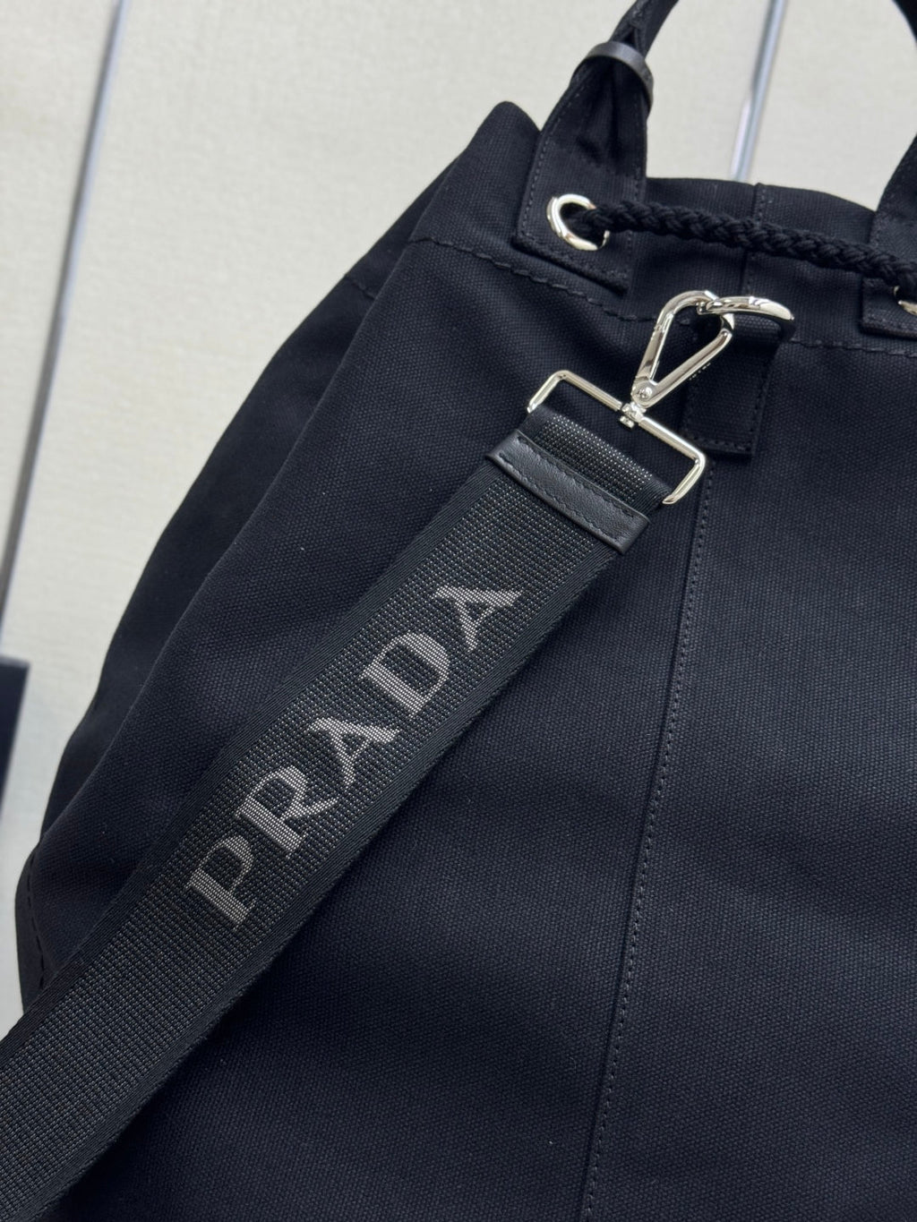 PRADA 25S DRAWSTRING BACKPACK 55 IN BLACK CANVAS LINEN SILVER HARDWARE