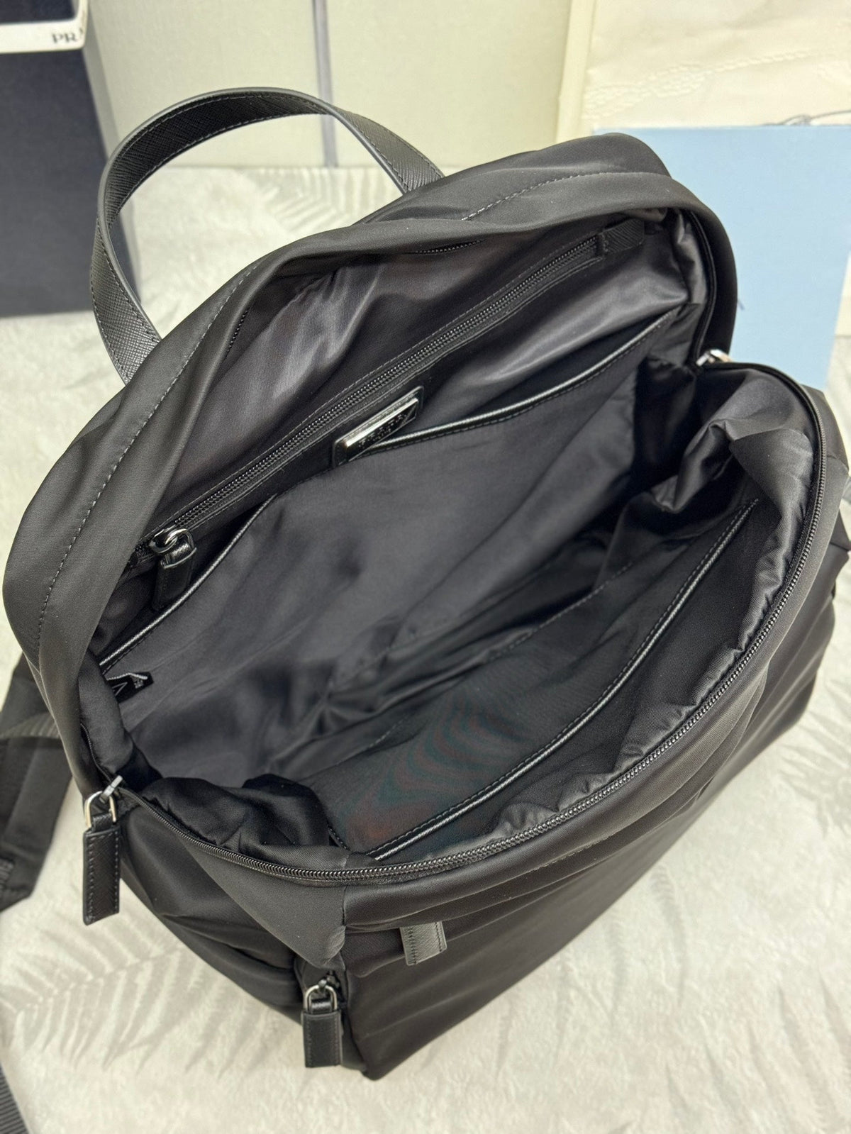 PRADA 25S BACKPACK 39 IN BLACK RE-NYLON AND SAFFIANO CALFSKIN